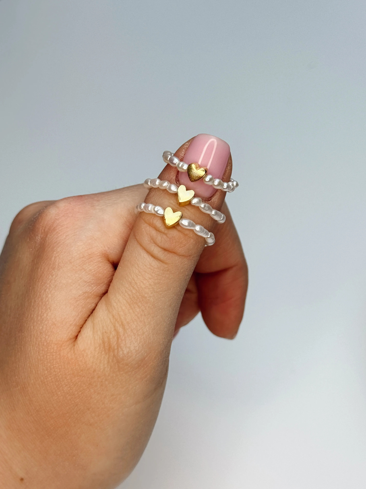 Handmade stretch ring with natural freshwater pearls and a gold-plated heart spacer – photo 2