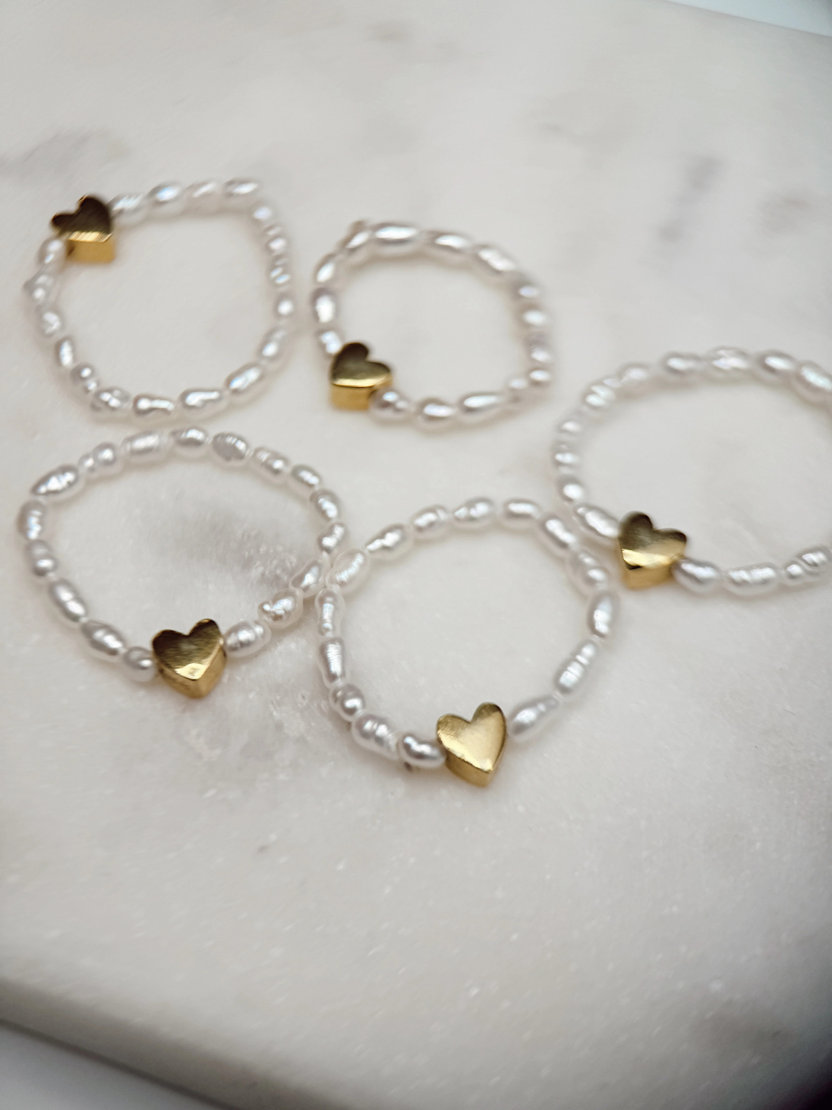Handmade stretch ring with natural freshwater pearls and a gold-plated heart spacer – photo 3