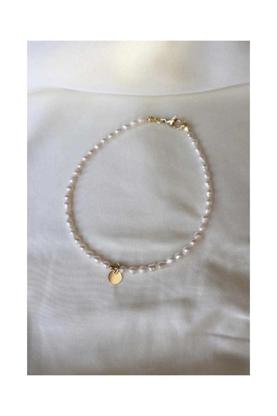 Anklet with natural freshwater pearls and hematite with a gold-plated silver charm, handmade