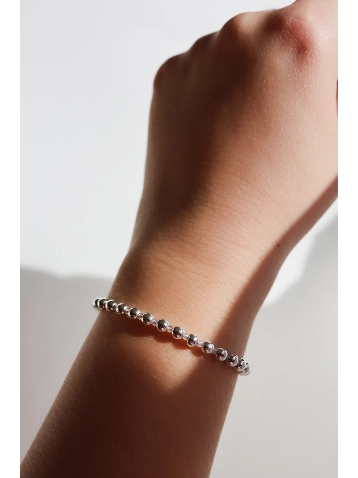 Adjustable silver-plated hematite bracelet with a tiny opal on steel wire, clasp, handmade