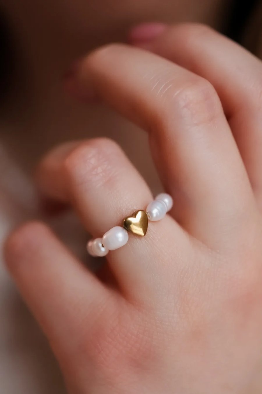 Stretch ring with cultured pearls and a large gold hematite heart on cord, handmade