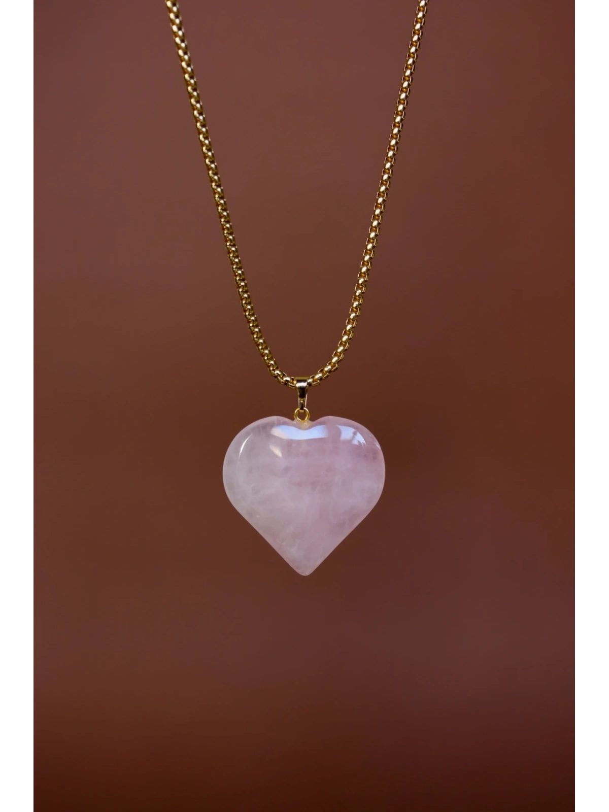 Handmade necklace with a large rose quartz heart pendant on a surgical steel snake chain