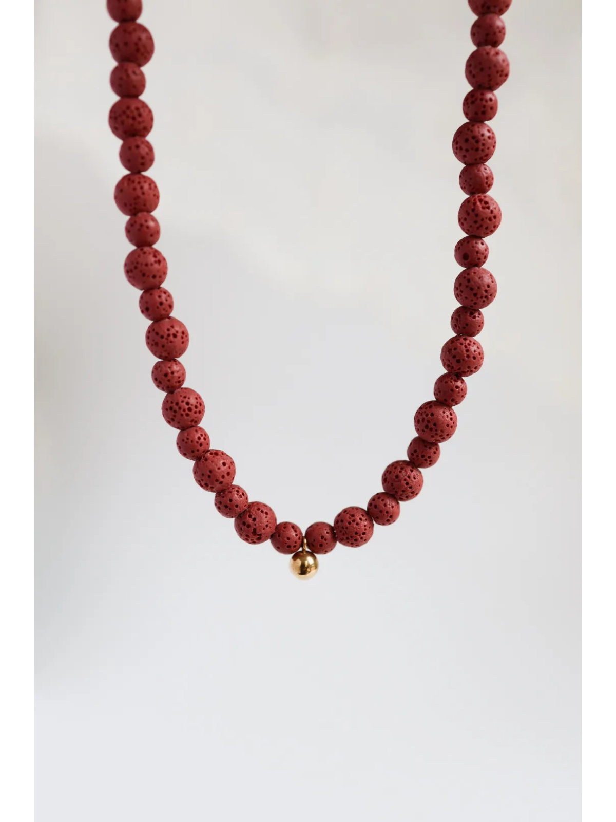 Adjustable volcanic lava necklace with a stainless steel clasp and gold-plated silver jump rings, handmade