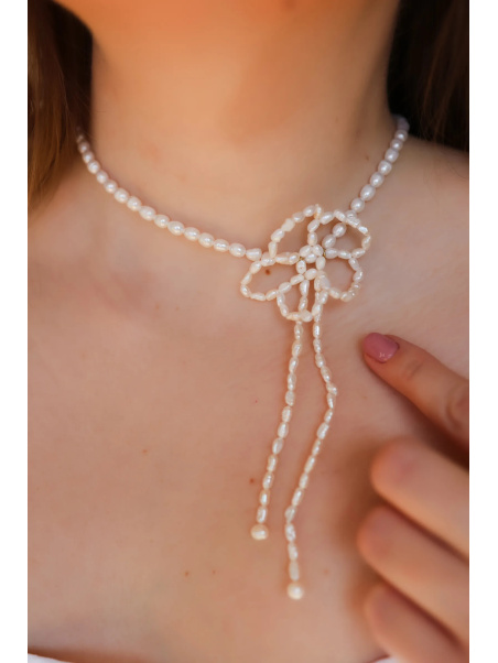 Adjustable necklace of small cultured freshwater pearls with a hand-woven silver flower, handmade